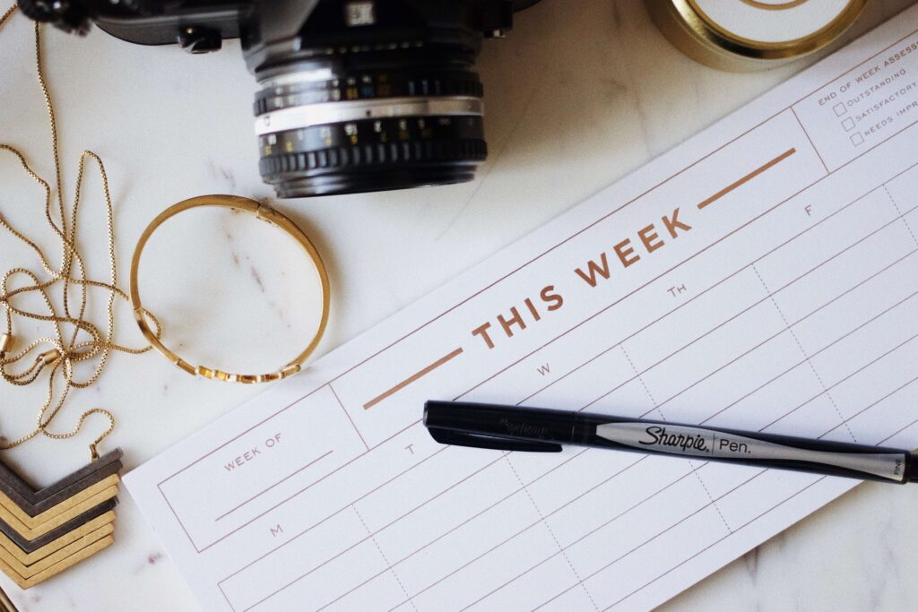 Blank weekly planner with pen