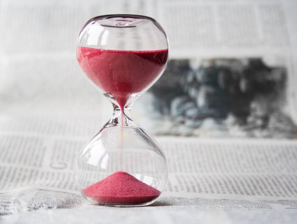 Hourglass with red sand