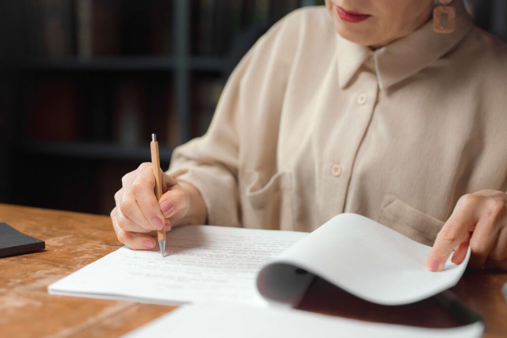 Woman proofreading, editing notes