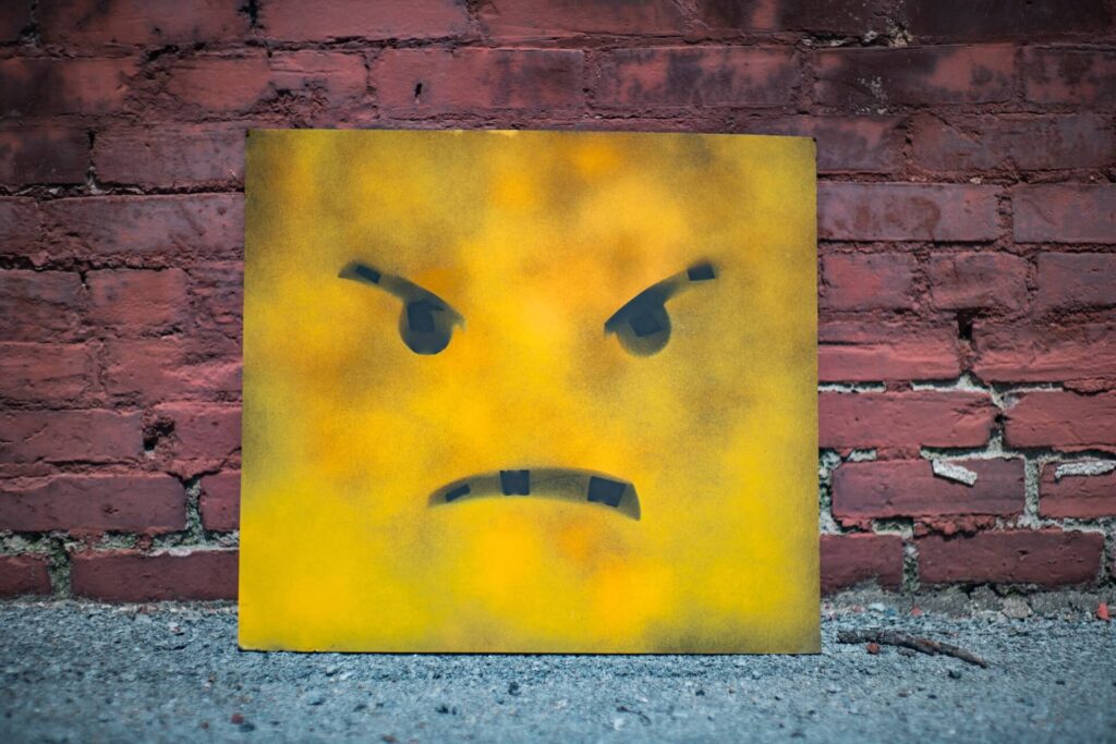 angry face on brick wall