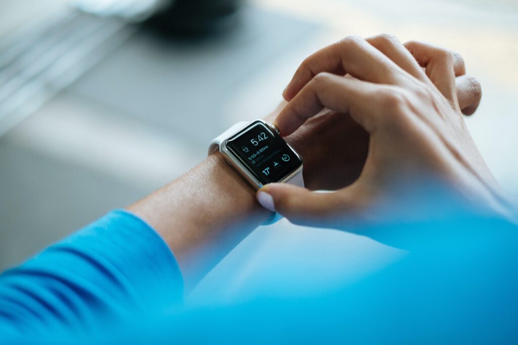 man wearing watch showing time