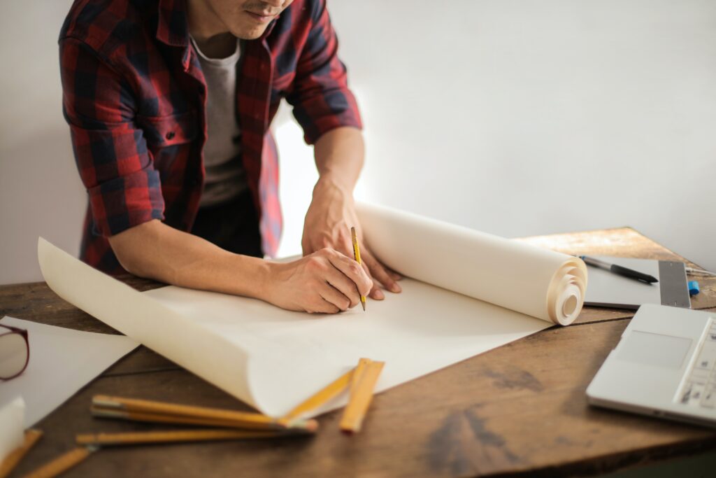 man drafting on a blank paper