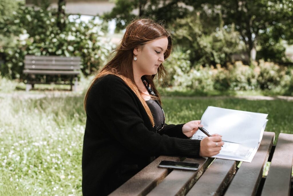 Woman writing on notebook