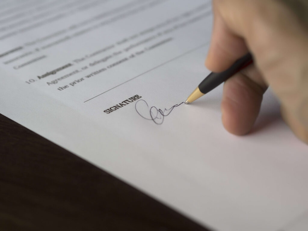 hand signing a document