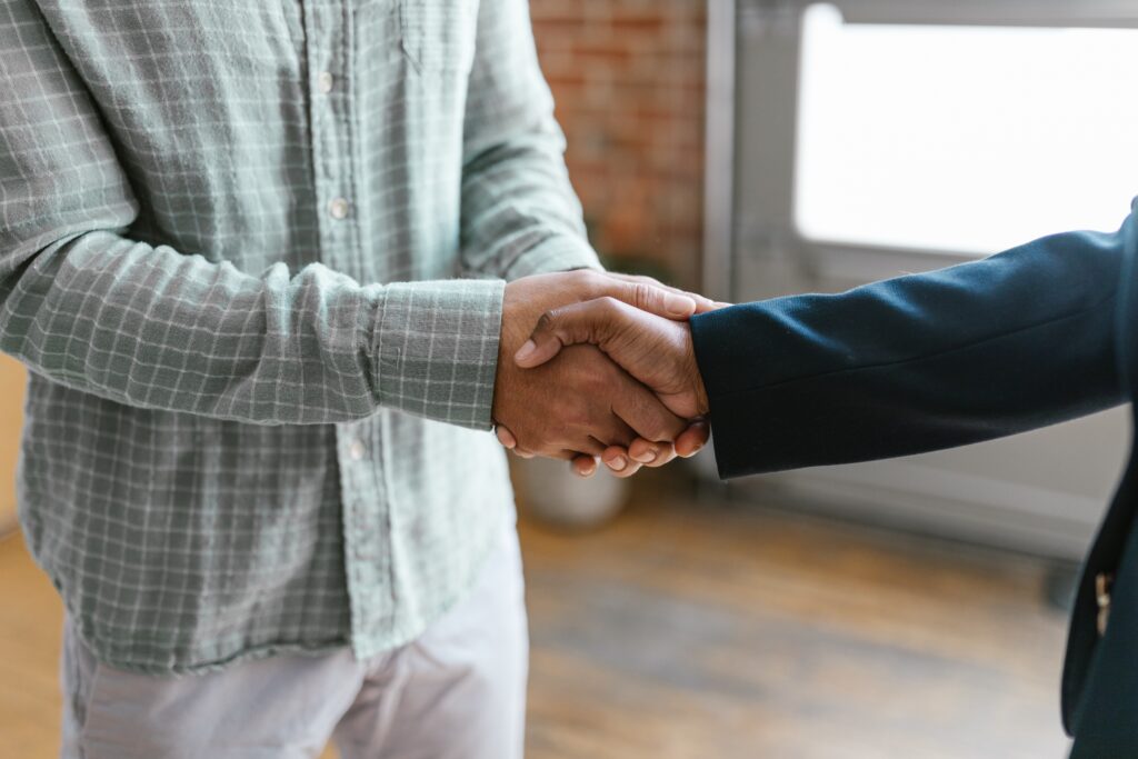 two persons shaking hands