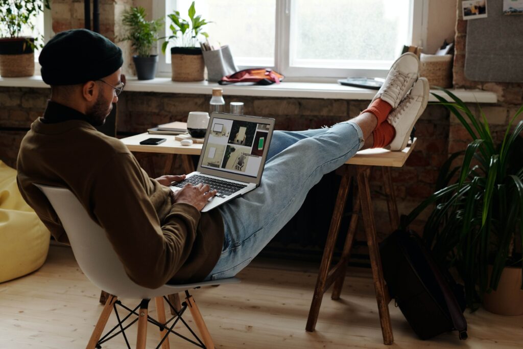 man relaxing while working