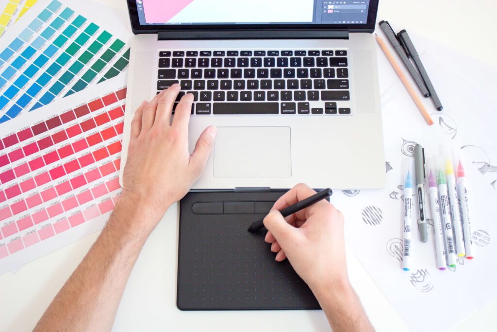 laptop, color palette, pens and pen mouse