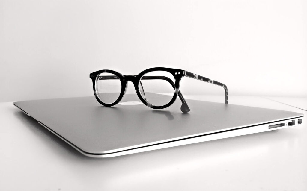 macbook, eye glasses