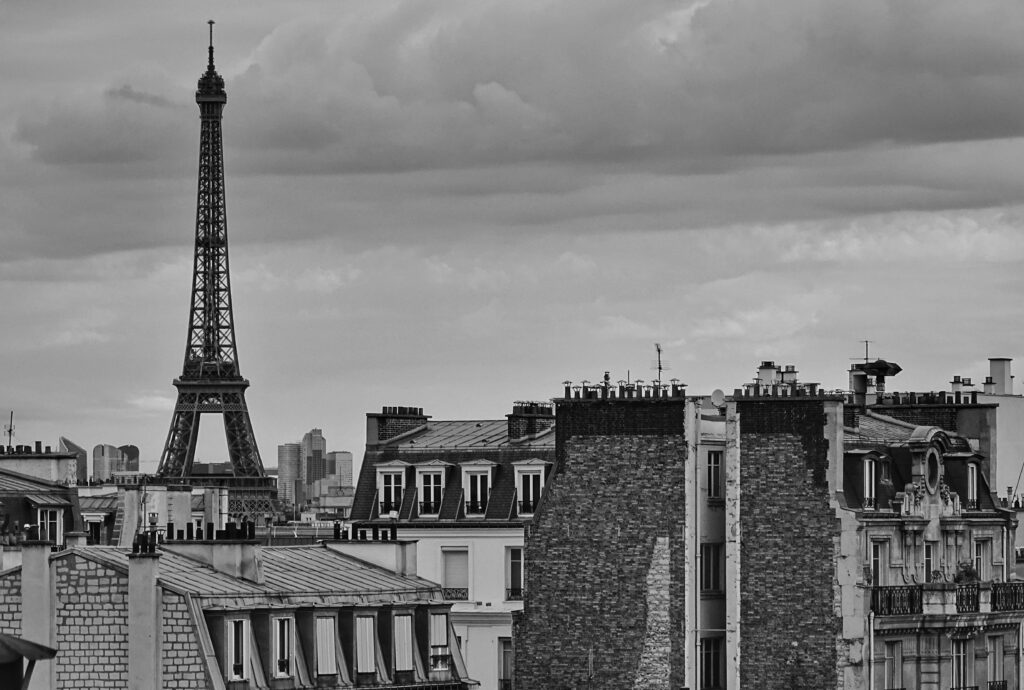 black and white photo of the Eiffel Tower and some buildings