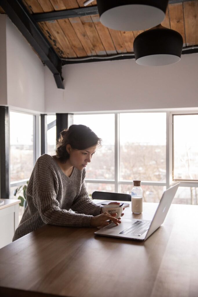 Woman using a laptop on a table