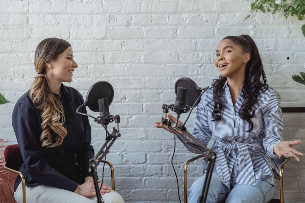 two women talking on mic