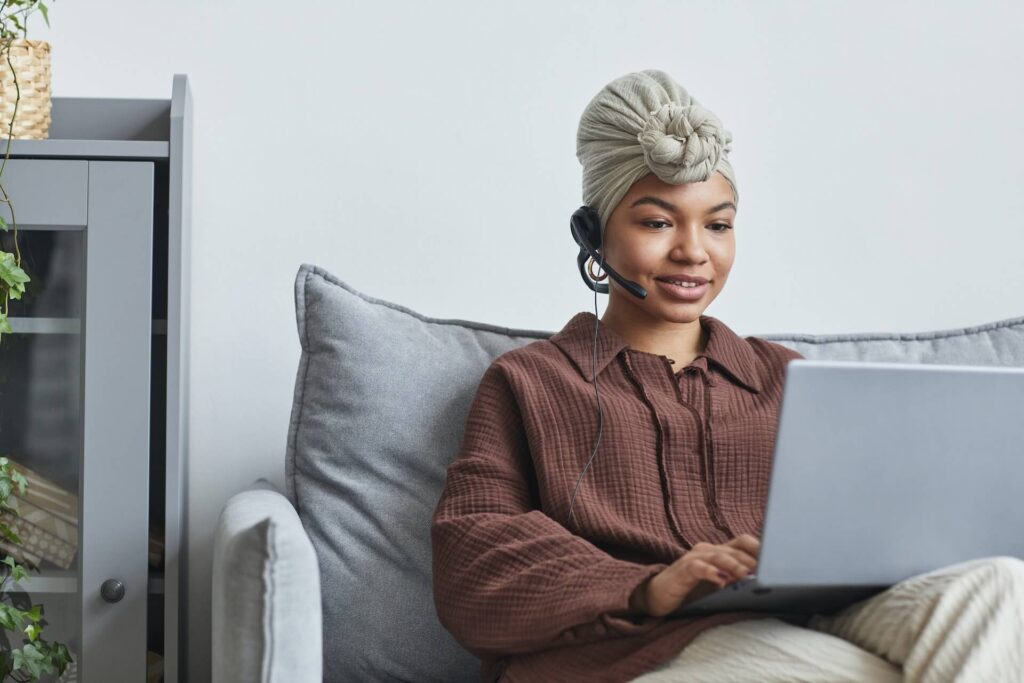 woman on a call looking at laptop