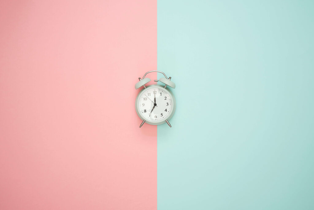 clock with pink and teal background