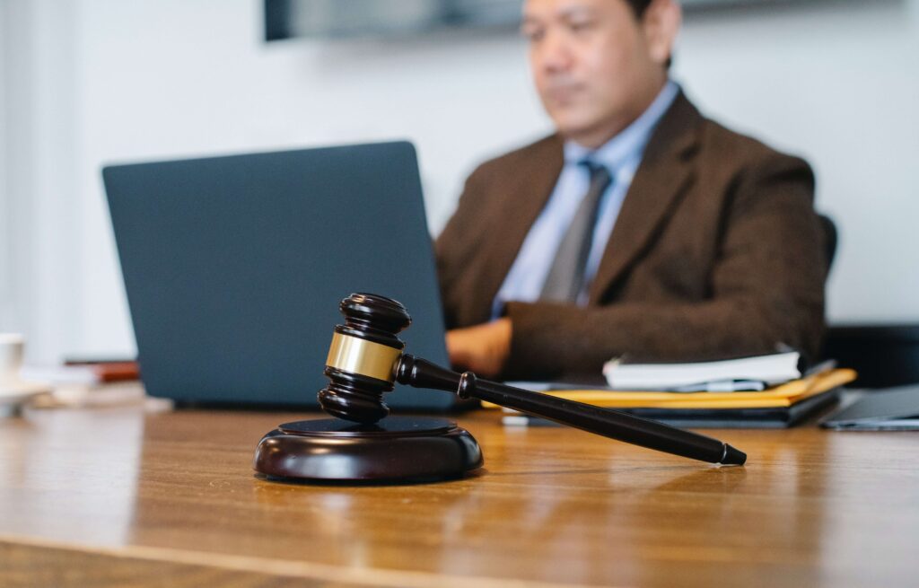 gavel with blurred lawyer on the background