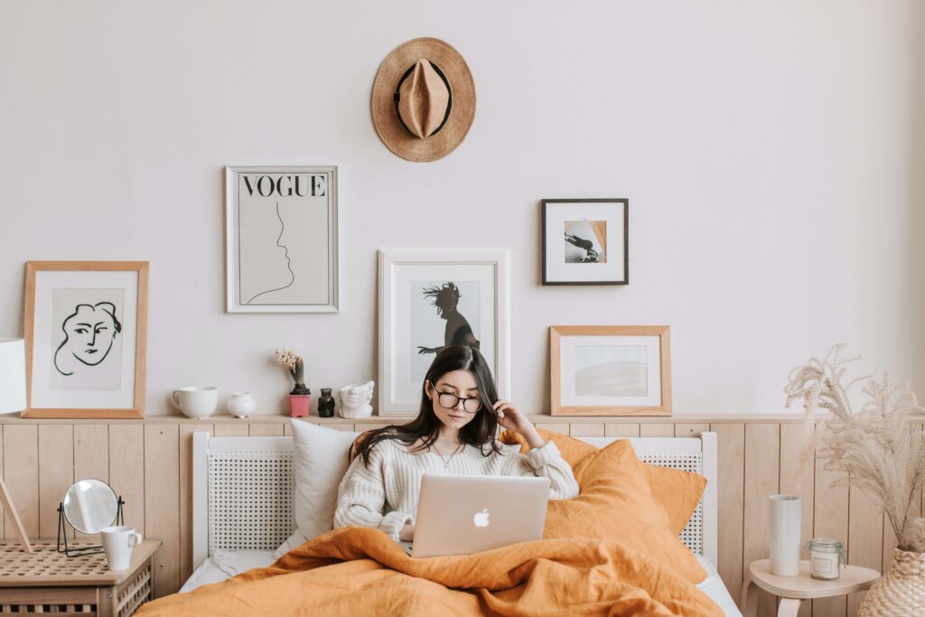 Woman in bed using a laptop